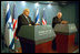 Israel's Prime Minister Ariel Sharon and Vice President Dick Cheney discuss a vision of peace for Israel and Palestine as they conduct a press briefing in Jerusalem, Israel, March 19. "It is our hope that the current violence and terrorism will be replaced by reconciliation and the rebuilding of mutual trust," said the Vice President.